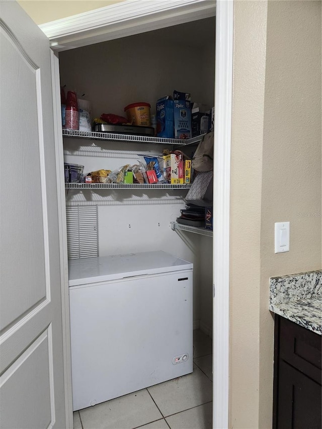 144 Hawthorne Way, Davenport, FL 33896 - laundry area with light tile patterned flooring