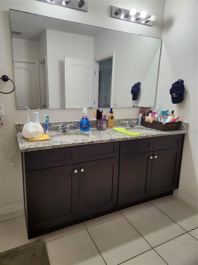 144 Hawthorne Way, Davenport, FL 33896 - bathroom with double vanity and tile patterned flooring