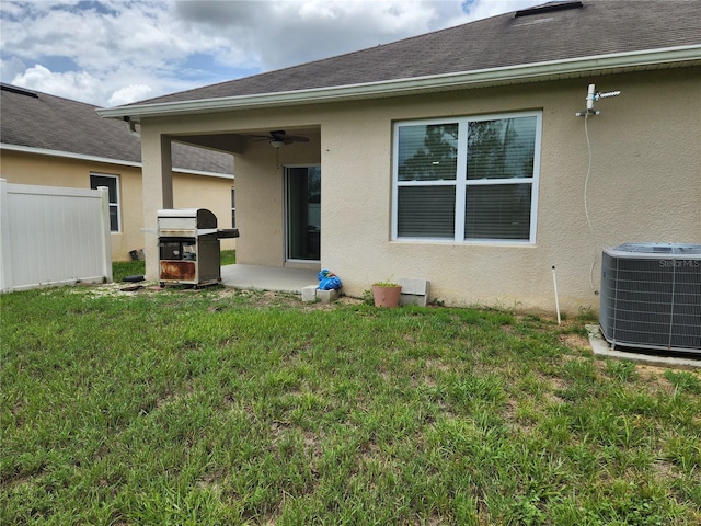 144 Hawthorne Way, Davenport, FL 33896 - rear view of house featuring a ceiling fan, stucco siding, and a patio area
