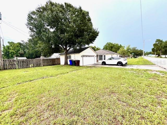 812 10th St, Saint Cloud, FL 34769 - view of yard featuring driveway