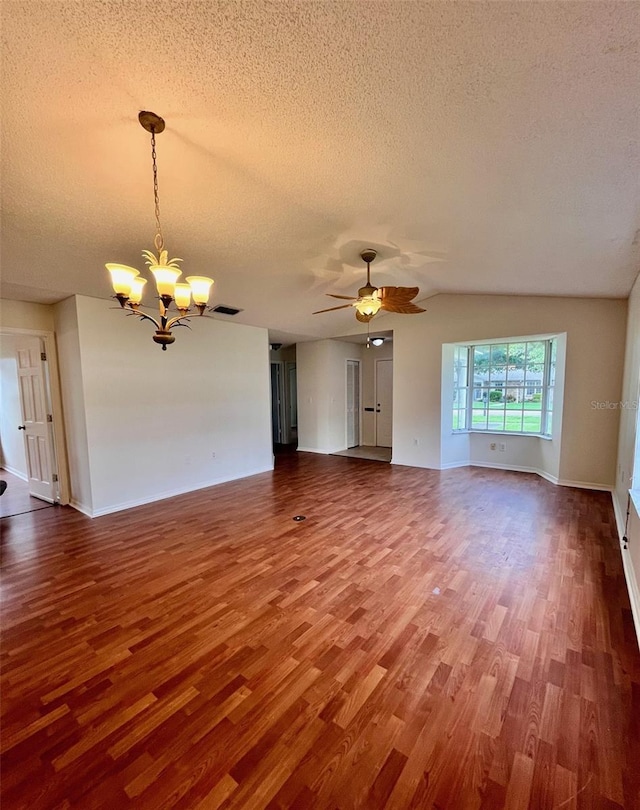 812 10th St, Saint Cloud, FL 34769 - unfurnished living room with a chandelier, wood finished floors, a textured ceiling, a ceiling fan, and lofted ceiling