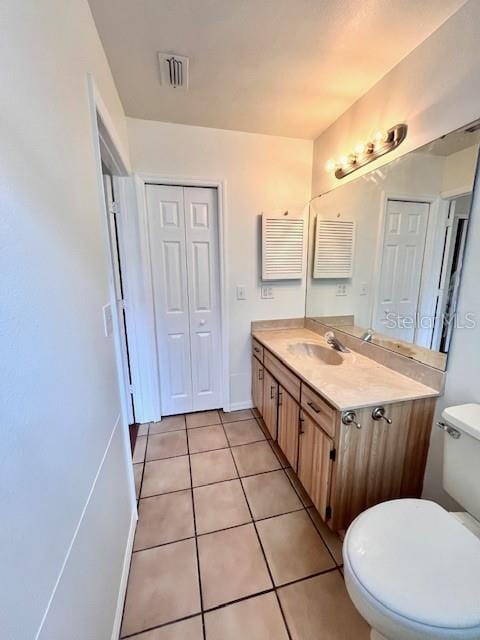 812 10th St, Saint Cloud, FL 34769 - bathroom featuring vanity and tile patterned flooring