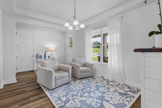 3252 Jackson Bluff Way, Clermont, FL 34711 - sitting room featuring wood finished floors, a tray ceiling, and a chandelier