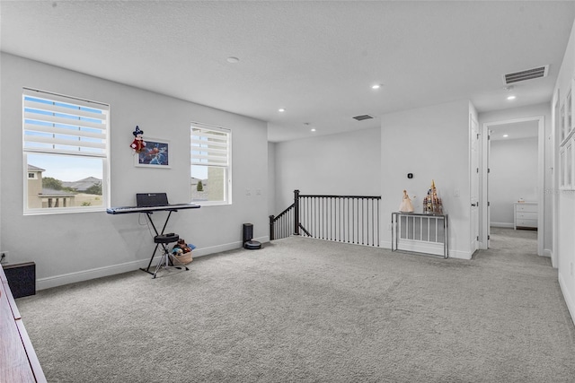 3252 Jackson Bluff Way, Clermont, FL 34711 - unfurnished room featuring an upstairs landing, carpet, recessed lighting, and healthy amount of natural light