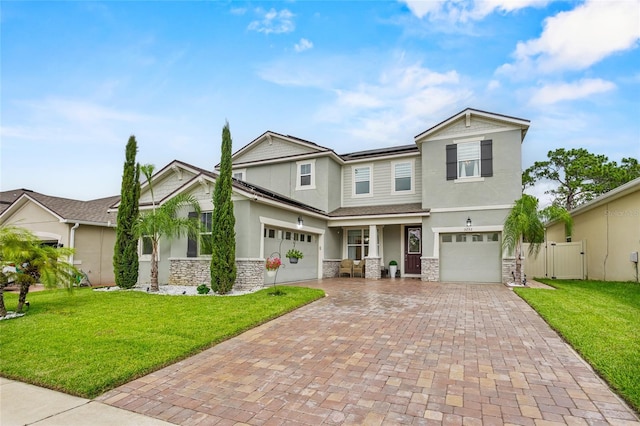 3252 Jackson Bluff Way, Clermont, FL 34711 - craftsman-style house with stone siding, stucco siding, decorative driveway, and a garage