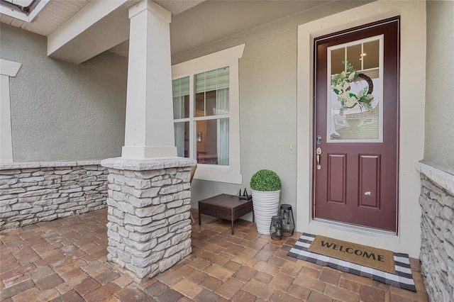 3252 Jackson Bluff Way, Clermont, FL 34711 - doorway to property featuring stucco siding and covered porch