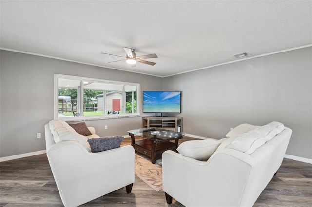 27805 Lois Dr, Tavares, FL 32778 - living room featuring ceiling fan, wood finished floors, and ornamental molding