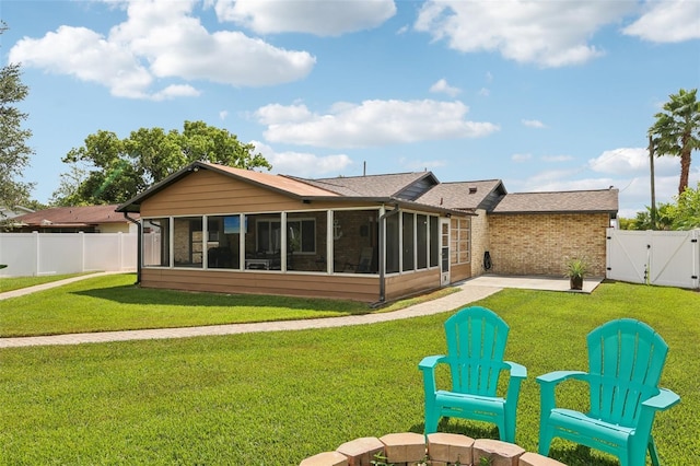 27805 Lois Dr, Tavares, FL 32778 - back of property featuring a sunroom, a gate, a fenced backyard, and a patio