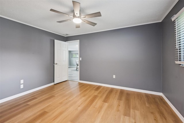 27805 Lois Dr, Tavares, FL 32778 - spare room featuring light wood finished floors, a ceiling fan, and ornamental molding