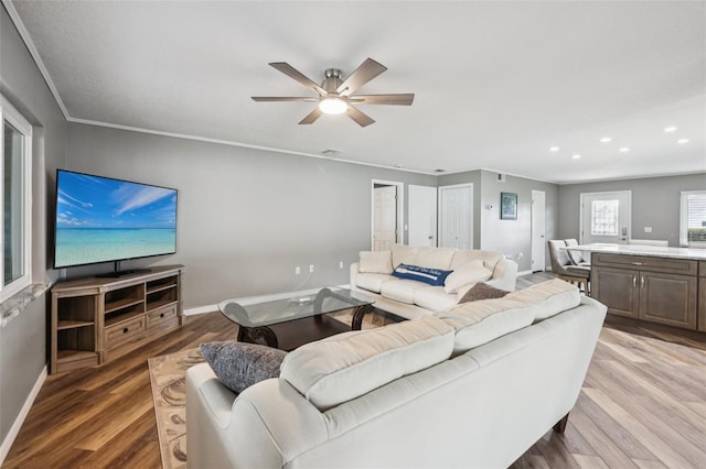 27805 Lois Dr, Tavares, FL 32778 - living room featuring light wood-type flooring, ceiling fan, recessed lighting, and ornamental molding