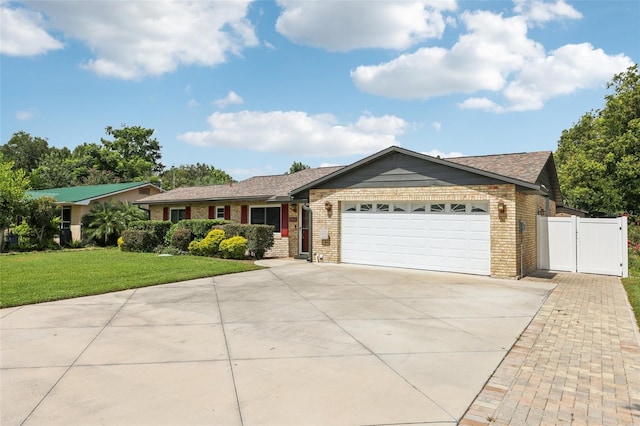 27805 Lois Dr, Tavares, FL 32778 - ranch-style home featuring brick siding, driveway, a garage, and a shingled roof