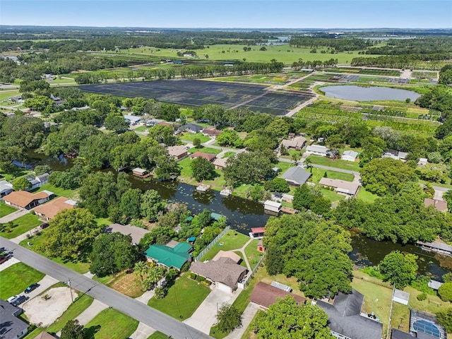 27805 Lois Dr, Tavares, FL 32778 - aerial overview of property's location featuring a nearby body of water and nearby suburban area