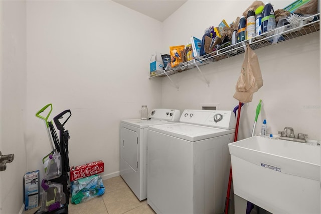 2823 Sail Breeze Way, Kissimmee, FL 34744 - washroom with washer and dryer and light tile patterned floors