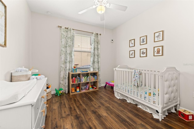 2823 Sail Breeze Way, Kissimmee, FL 34744 - bedroom featuring a crib, wood finished floors, and ceiling fan