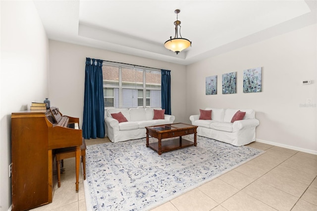 2823 Sail Breeze Way, Kissimmee, FL 34744 - living room with light tile patterned flooring and a raised ceiling