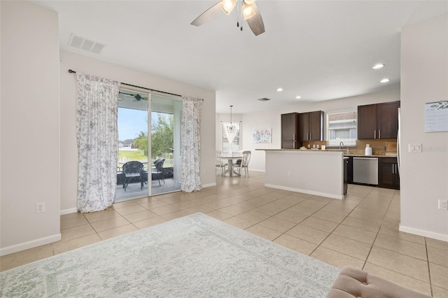 2823 Sail Breeze Way, Kissimmee, FL 34744 - kitchen with dishwasher, dark brown cabinets, light tile patterned floors, a ceiling fan, and recessed lighting