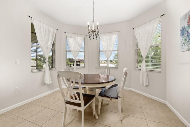 2823 Sail Breeze Way, Kissimmee, FL 34744 - dining area with light tile patterned floors and a chandelier