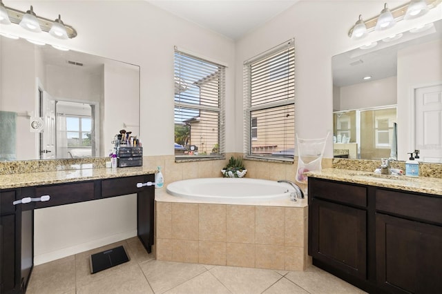 2823 Sail Breeze Way, Kissimmee, FL 34744 - bathroom with a stall shower, a garden tub, vanity, and tile patterned flooring