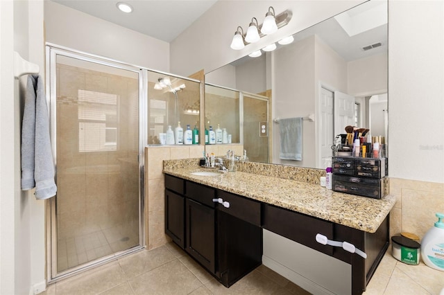 2823 Sail Breeze Way, Kissimmee, FL 34744 - full bathroom featuring tile patterned floors, vanity, and a shower stall