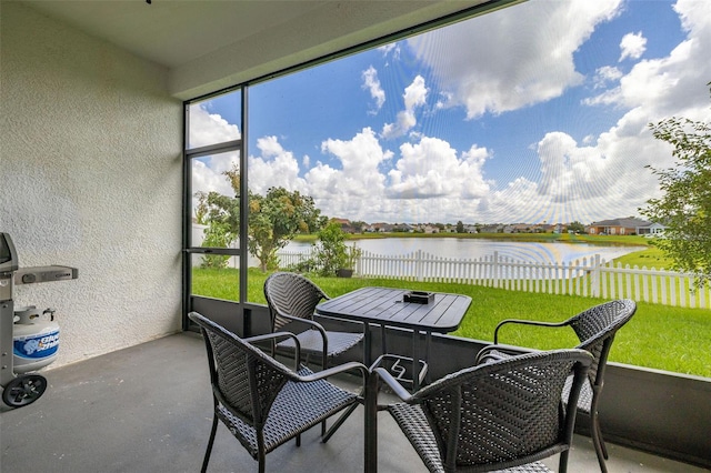 2823 Sail Breeze Way, Kissimmee, FL 34744 - sunroom / solarium with a water view and outdoor dining space