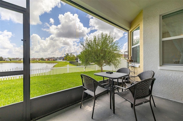 2823 Sail Breeze Way, Kissimmee, FL 34744 - sunroom with a water view and outdoor dining space