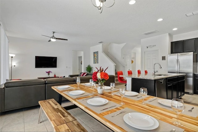 2231 Crofton Springs Ct, Davenport, FL 33837 - dining space with light tile patterned floors, ceiling fan, recessed lighting, and a textured ceiling