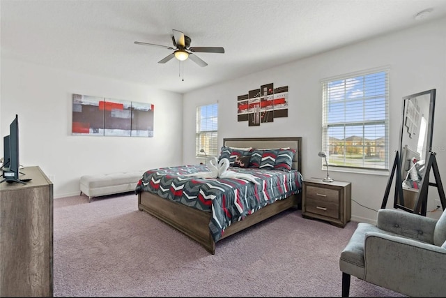 2231 Crofton Springs Ct, Davenport, FL 33837 - carpeted bedroom with baseboards and a ceiling fan