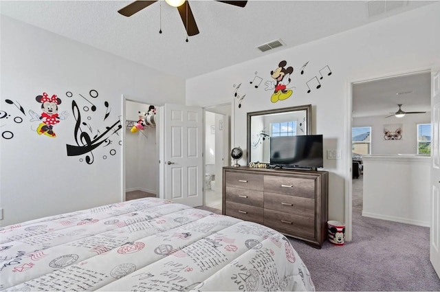 2231 Crofton Springs Ct, Davenport, FL 33837 - carpeted bedroom with ceiling fan and a textured ceiling