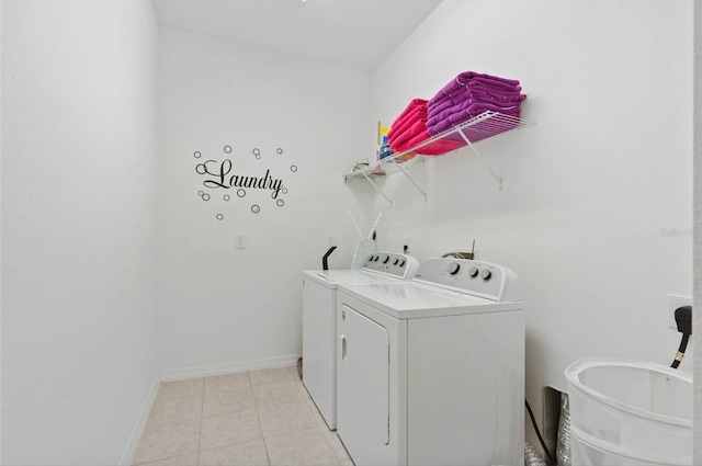 2231 Crofton Springs Ct, Davenport, FL 33837 - laundry area featuring independent washer and dryer and light tile patterned flooring