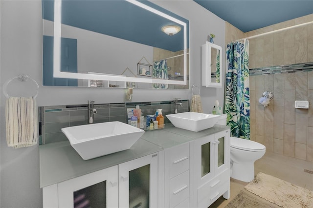 1203 Monterey Dr, Eustis, FL 32726 - full bathroom featuring double vanity, tiled shower, and tasteful backsplash