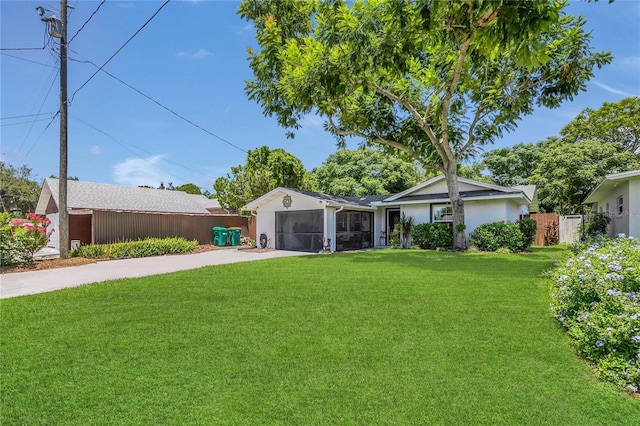 1203 Monterey Dr, Eustis, FL 32726 - single story home featuring concrete driveway, a sunroom, a garage, and stucco siding