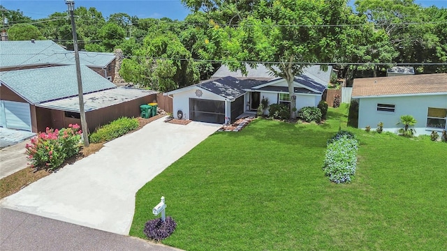 1203 Monterey Dr, Eustis, FL 32726 - view of front of house featuring driveway, a front lawn, and an attached garage