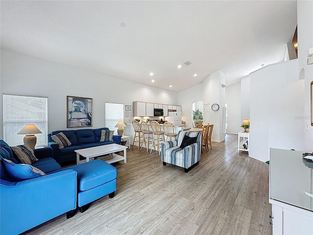 344 Bloomingdale Dr, Davenport, FL 33897 - living room with light wood-style floors, recessed lighting, and high vaulted ceiling