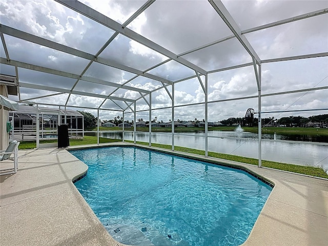 344 Bloomingdale Dr, Davenport, FL 33897 - swimming pool featuring a water view, a patio, and glass enclosure