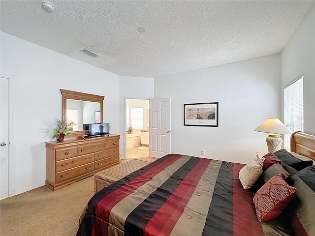 344 Bloomingdale Dr, Davenport, FL 33897 - bedroom featuring a textured ceiling, light colored carpet, and ensuite bath