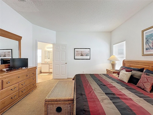 344 Bloomingdale Dr, Davenport, FL 33897 - bedroom with light carpet, a textured ceiling, and ensuite bathroom