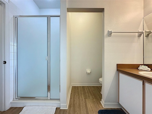 344 Bloomingdale Dr, Davenport, FL 33897 - full bathroom with wood finished floors, a shower stall, and vanity