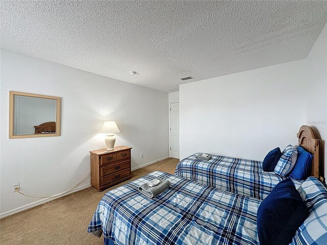 344 Bloomingdale Dr, Davenport, FL 33897 - bedroom featuring light carpet and a textured ceiling