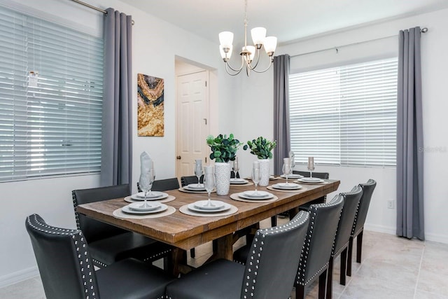 8937 Amelia Downs Trl, Kissimmee, FL 34747 - dining space with a chandelier and light tile patterned floors
