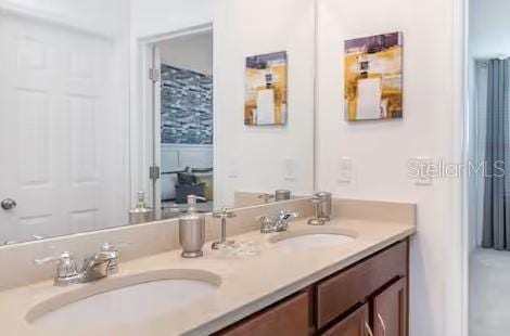 8937 Amelia Downs Trl, Kissimmee, FL 34747 - full bathroom featuring double vanity