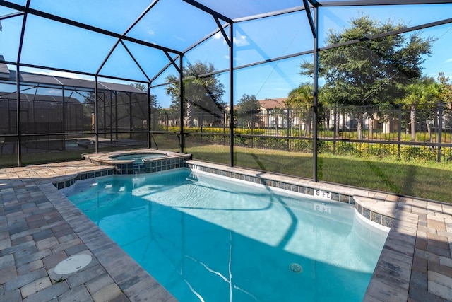 8937 Amelia Downs Trl, Kissimmee, FL 34747 - view of swimming pool featuring a pool with connected hot tub, glass enclosure, and a patio area