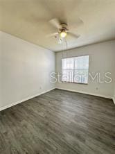 3351 Whitestone Cir Unit 204, Kissimmee, FL 34741 - empty room featuring ceiling fan and wood finished floors