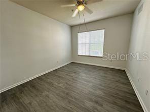 3351 Whitestone Cir Unit 204, Kissimmee, FL 34741 - unfurnished room featuring a ceiling fan and dark wood finished floors