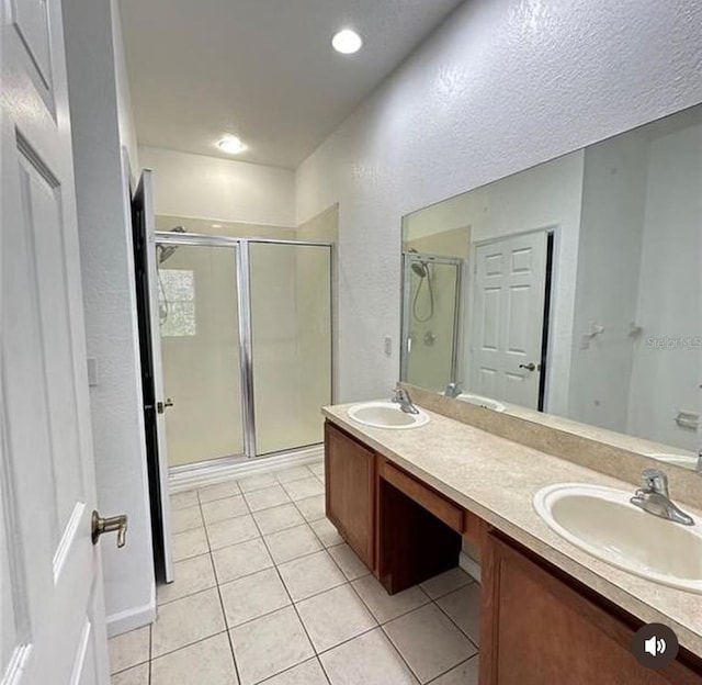 3351 Whitestone Cir Unit 204, Kissimmee, FL 34741 - bathroom with a shower stall, double vanity, and tile patterned flooring
