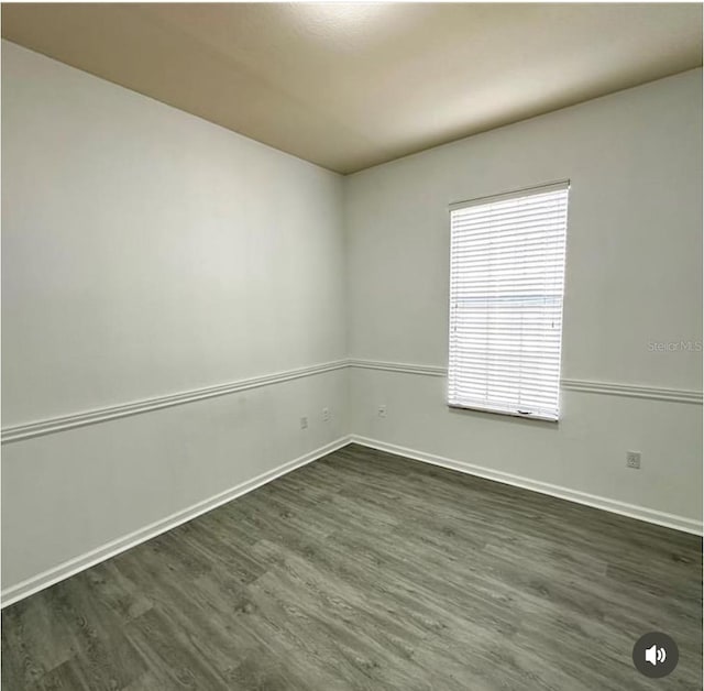 3351 Whitestone Cir Unit 204, Kissimmee, FL 34741 - empty room with plenty of natural light and dark wood finished floors