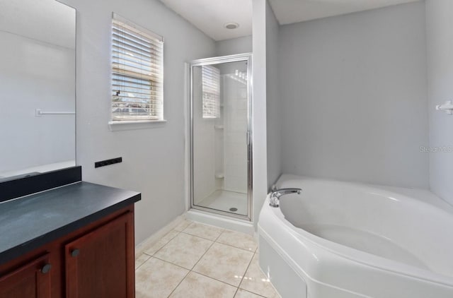 877 Scrub Jay Way, Davenport, FL 33896 - bathroom with a bath, a stall shower, vanity, and tile patterned floors