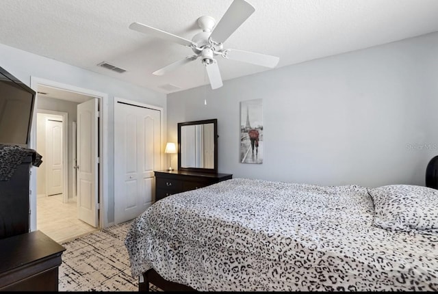 877 Scrub Jay Way, Davenport, FL 33896 - bedroom with light tile patterned flooring, a closet, and ceiling fan