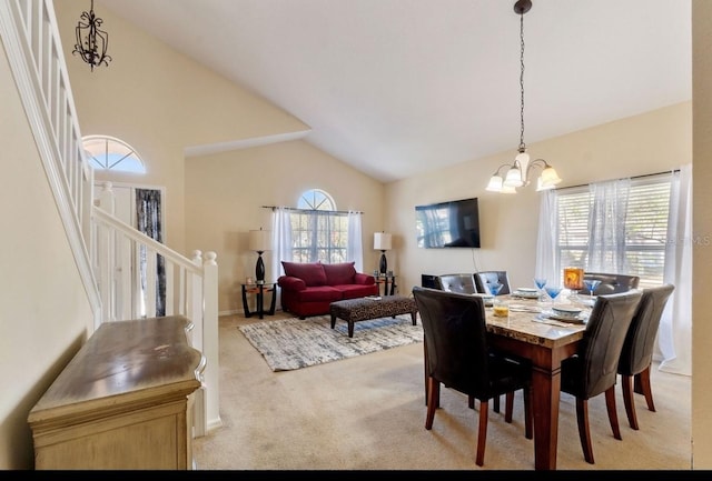 877 Scrub Jay Way, Davenport, FL 33896 - dining space with a chandelier, carpet flooring, healthy amount of natural light, vaulted ceiling, and stairway