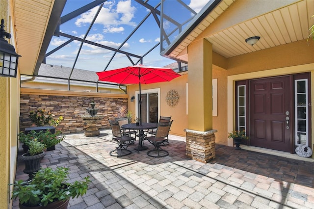 217 Sorrento Rd, Poinciana, FL 34759 - view of patio / terrace with a lanai and outdoor dining area