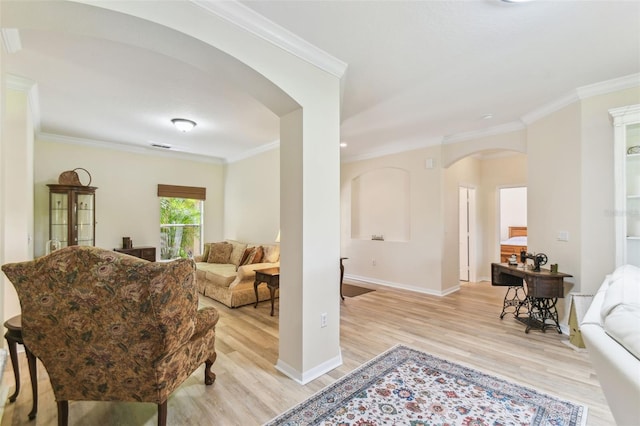 217 Sorrento Rd, Poinciana, FL 34759 - living room featuring arched walkways, light wood-style floors, and ornamental molding
